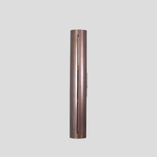Slim vertical profile of handmade brass wall sconce, showcasing sleek industrial design with elongated cut detail.