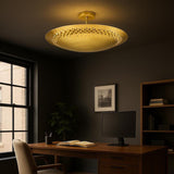 Solid brass disc flush mount ceiling light installed in a modern home office space