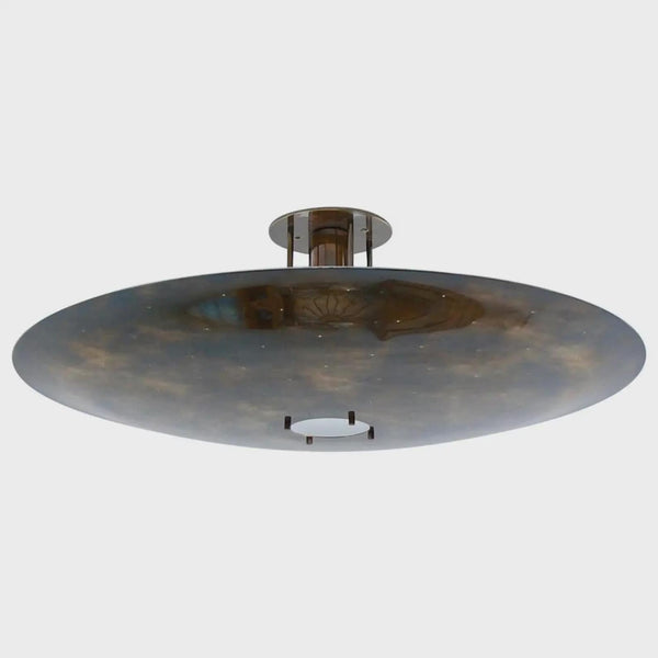 Sculptural brass disc flush mount ceiling light with wide bowl shade and warm indirect glow, handcrafted in solid brass by Brass Leaf Studio.