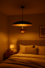 Brass dome pendant light glowing warmly above a bedroom setting, creating a soft and calming nighttime ambiance.