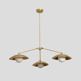 Handmade brass chandelier with three frosted globe bulbs and dome-shaped brass shades, minimalist ceiling pendant by Brass Leaf Studio.