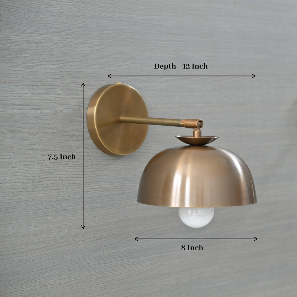 Brass dome shade wall sconce with dimensions – 8 inch width, 7.5 inch height, 12 inch depth