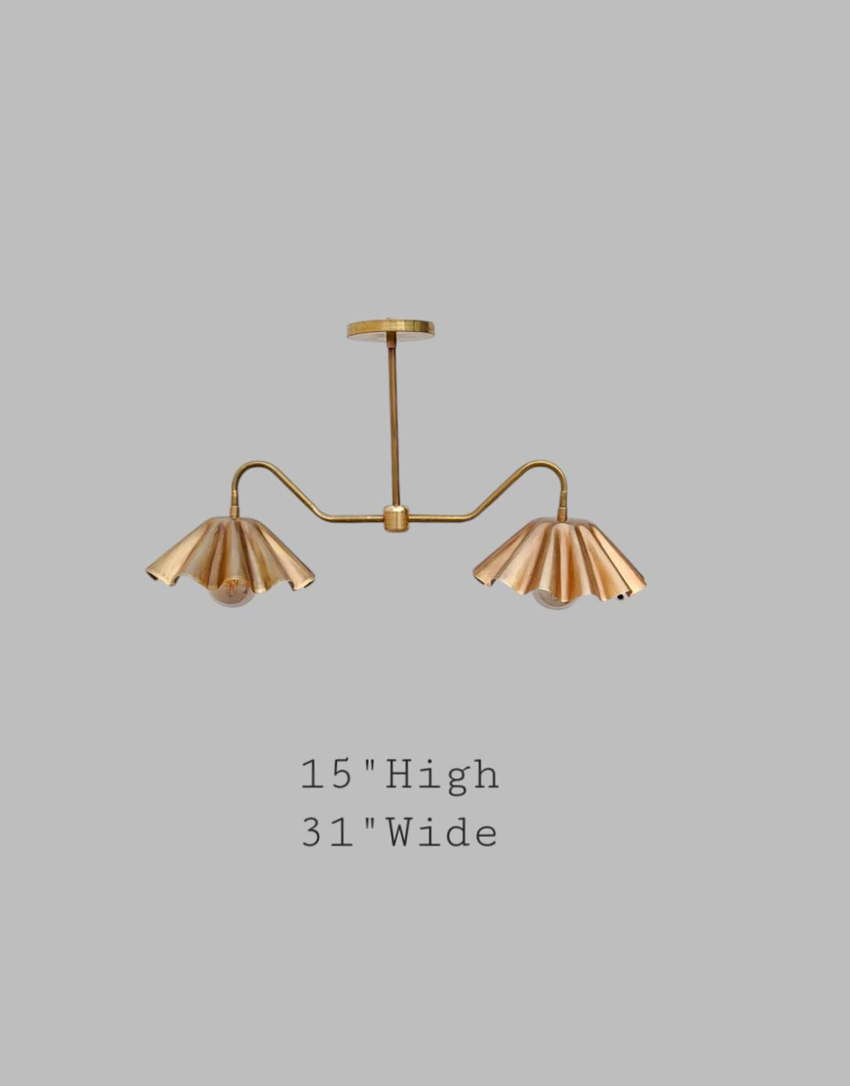 Brass double arm chandelier with wavy shades, 31 inches wide and 15 inches high
