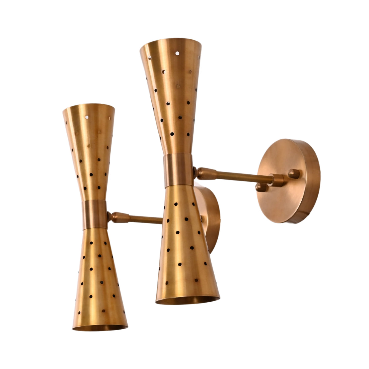 Angled view of brass double cone wall sconces showing perforated detailing and brushed brass finish