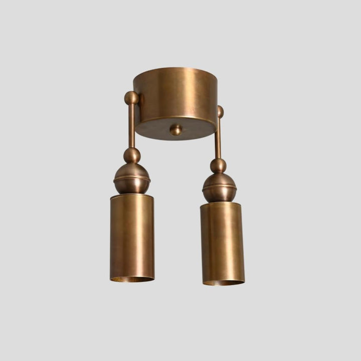 Solid brass double cylinder ceiling light, side angle view showing elegant minimalist industrial style