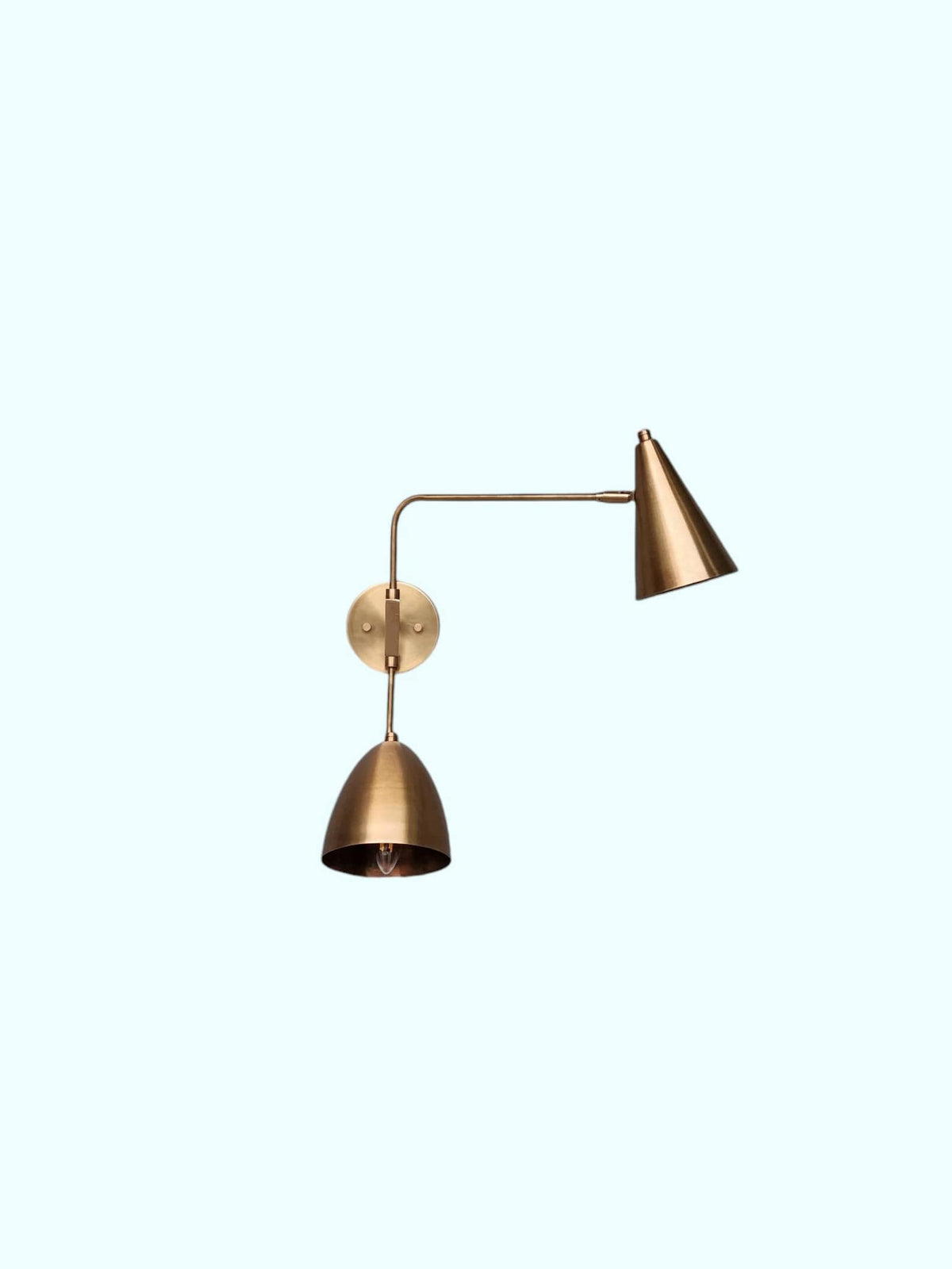 Modern brass double shade wall sconce with adjustable swing arms – front view