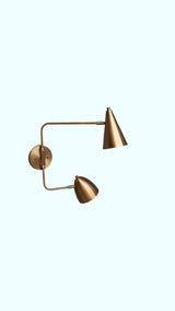 Minimalist handmade brass double shade wall sconce – straight-on view