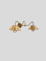 Custom brass wall sconce with two ruffled shades – side angle