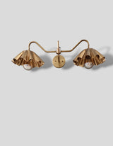 Elegant brass double wall light with curved arms and ruffle design shades