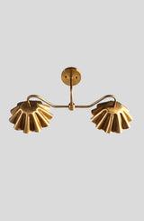 Brass double wall light fixture with sculpted ruffled shades – top view