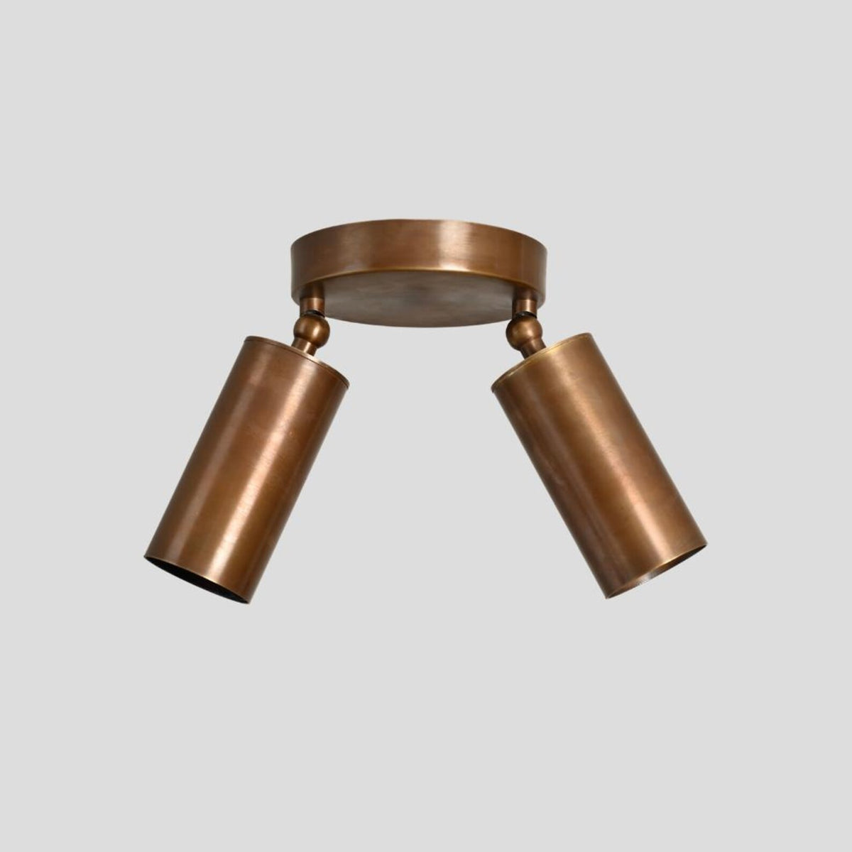 Solid brass flush mount ceiling fixture with two cylindrical shades, handcrafted modern lighting front view