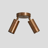 Solid brass flush mount ceiling fixture with two cylindrical shades, handcrafted modern lighting front view