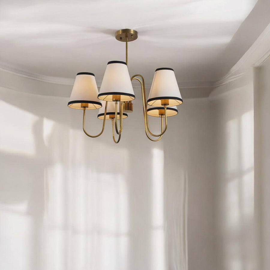 5 Light Brass Chandelier with white fabric shades and black trim, handcrafted by Brass Leaf Studio for elegant modern interiors