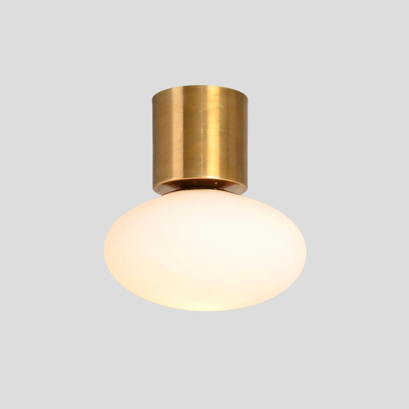Modern brass flush mount ceiling light with frosted glass globe, handmade minimalist fixture by Brass Leaf Studio.