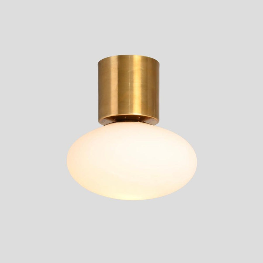 Modern brass flush mount ceiling light with frosted glass globe, handmade minimalist fixture by Brass Leaf Studio.