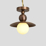 Industrial brass ceiling lamp with round opal globe diffuser and dome shade, suspended design perfect for dining rooms, cafes, and boutique spaces.