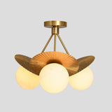 Brass flushmount chandelier with three frosted globe bulbs and fluted disc brass shades, handmade ceiling light by Brass Leaf Studio.