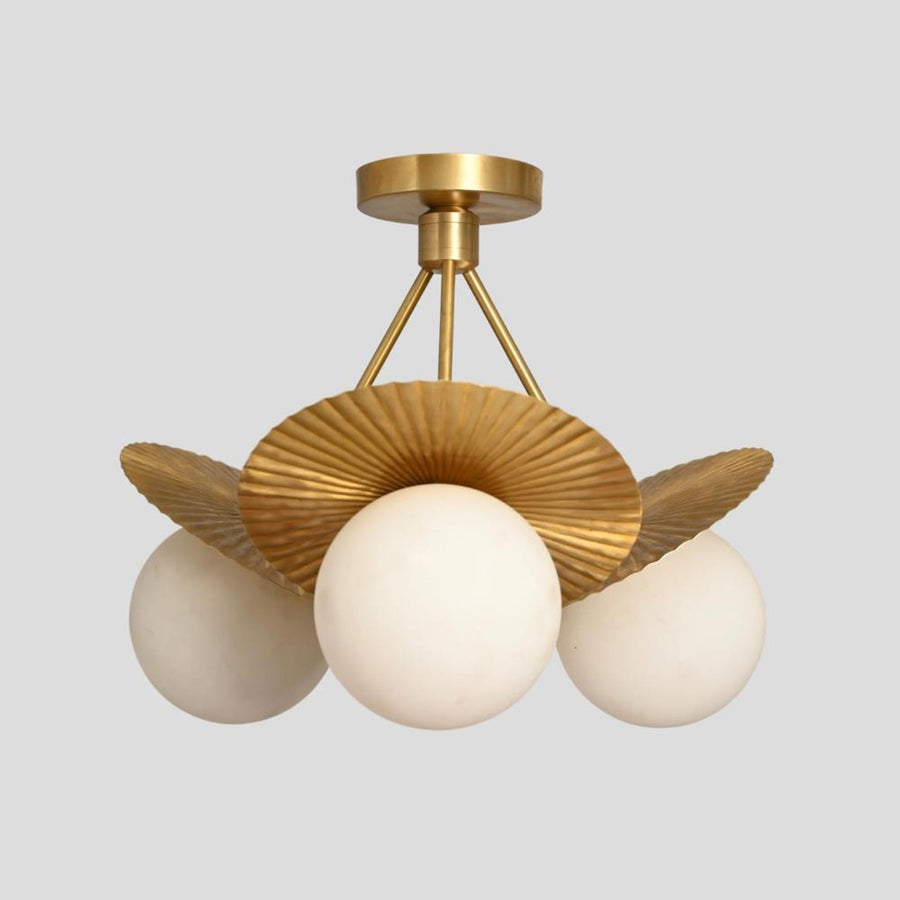 Brass flushmount chandelier with three frosted globe bulbs and fluted disc brass shades, handmade ceiling light by Brass Leaf Studio.