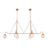 Brass linear chandelier with six glowing ribbed glass globes creating warm ambient light for modern luxury spaces
