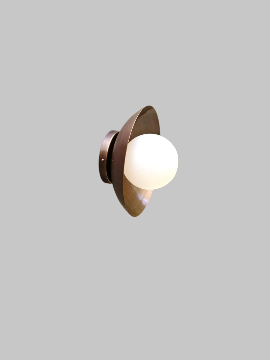 Elegant brass flush mount ceiling light with frosted glass globe, front view