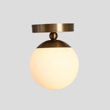 Modern brass ceiling light with opal glass globe shade – handcrafted flush mount lamp for living room or bedroom