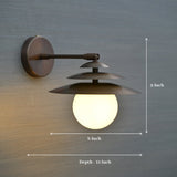 Dimensioned image of brass globe wall sconce with layered shades, measuring 8 inch width, 9 inch height, and 11 inch depth