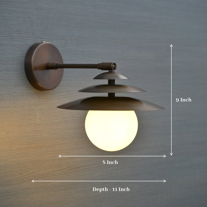Dimensioned image of brass globe wall sconce with layered shades, measuring 8 inch width, 9 inch height, and 11 inch depth