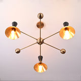 Top view of a 3-light brass cone shade chandelier by Brass Leaf Studio with mid-century modern design and warm ambient lighting.