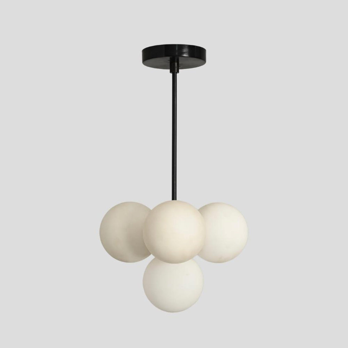 Minimalist black rod chandelier with frosted globe lights, handcrafted from premium brass – Brass Leaf Studio