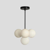 Minimalist black rod chandelier with frosted globe lights, handcrafted from premium brass – Brass Leaf Studio