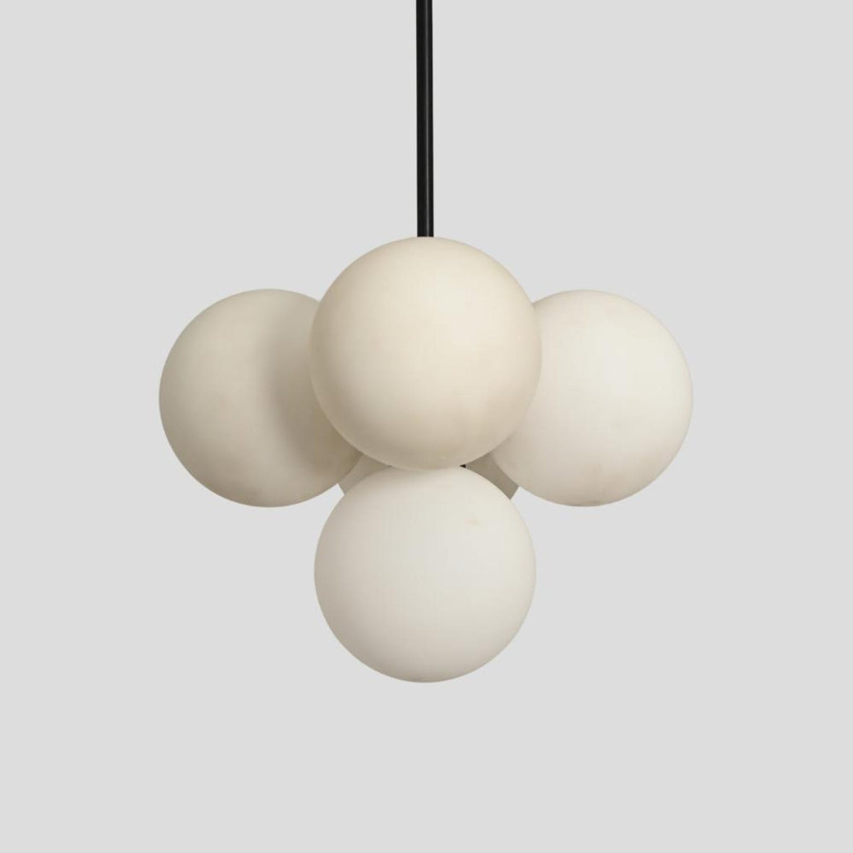 Contemporary brass chandelier with clustered frosted glass globes for modern interiors – Brass Leaf Studio