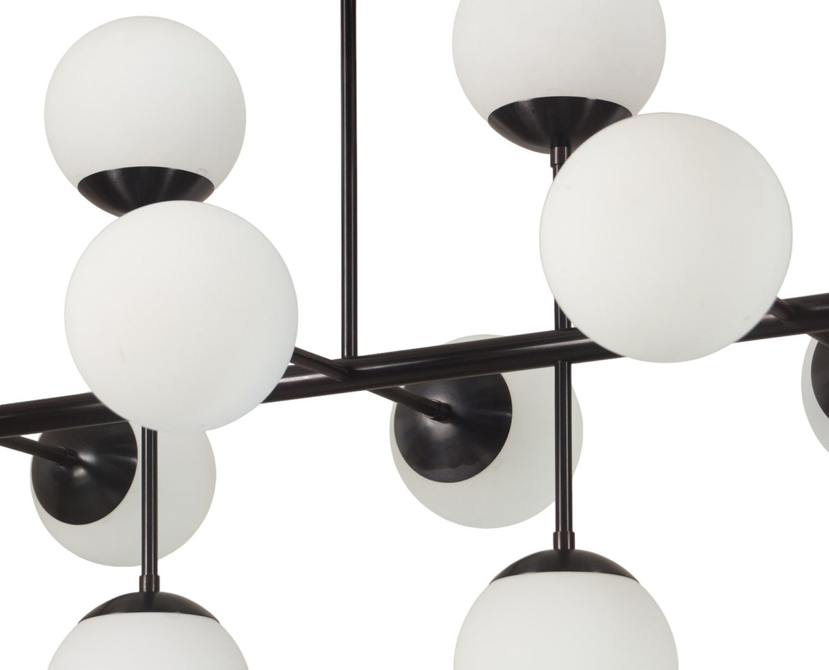 Close-up of matte black brass chandelier showing frosted glass globes and detailing – elegant handmade design by Brass Leaf Studio