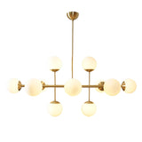 Warm glowing brass chandelier with frosted glass globes – handcrafted 10-light modern pendant by Brass Leaf Studio