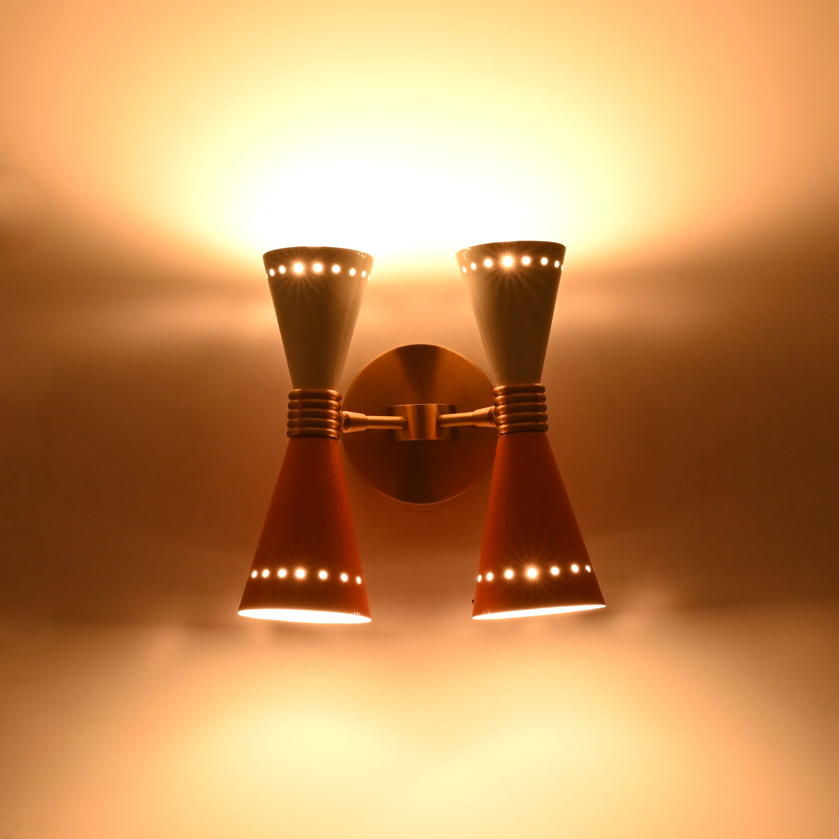 Brass Leaf Studio dual wall sconce with solid brass construction and retro diabolo shade design