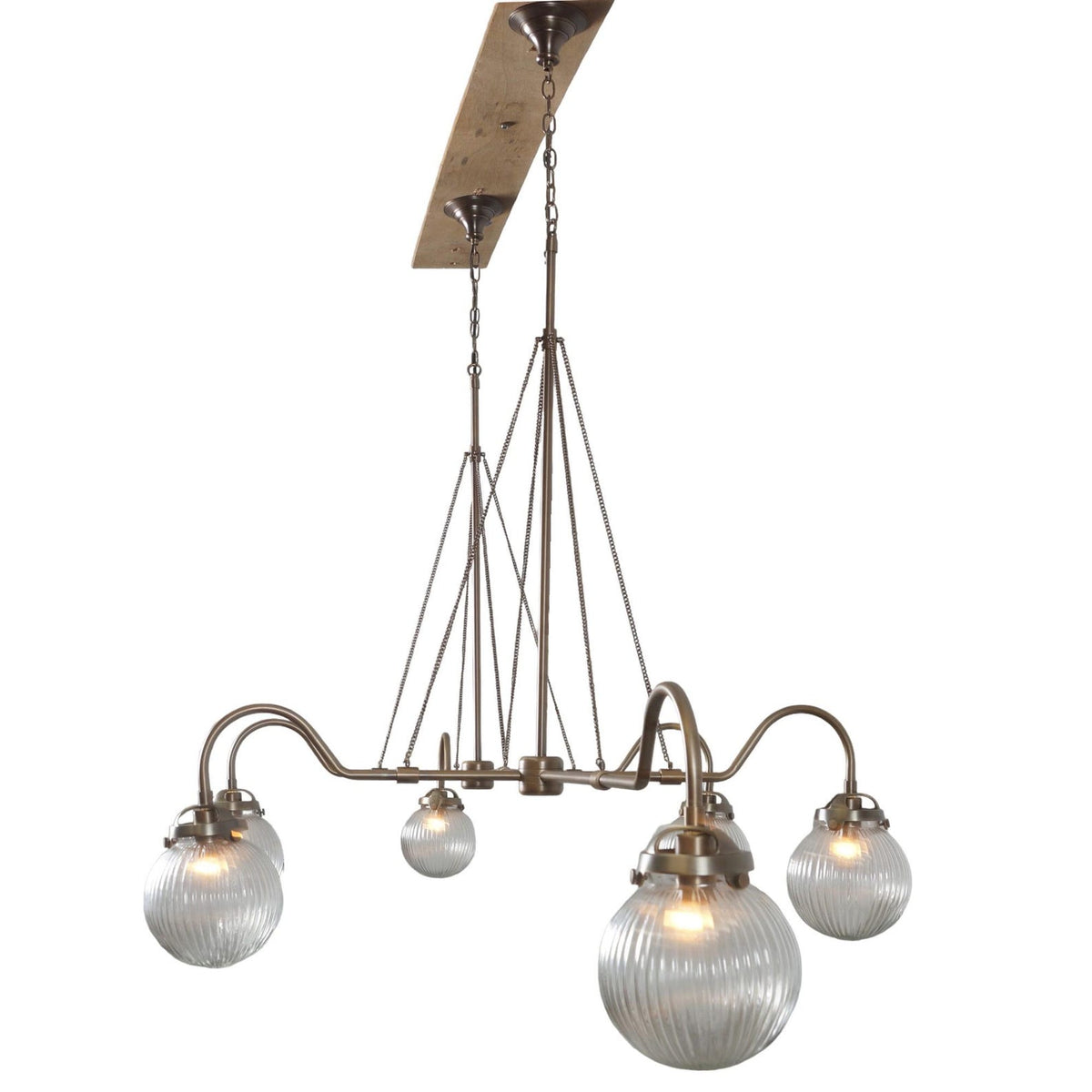 Side view of modern linear brass chandelier with six ribbed glass globes – artisan lighting design by Brass Leaf Studio