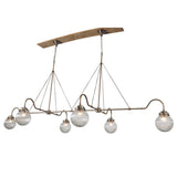 Angled view of linear 6-light brass chandelier with ribbed glass globes – elegant handmade lighting fixture by Brass Leaf Studio