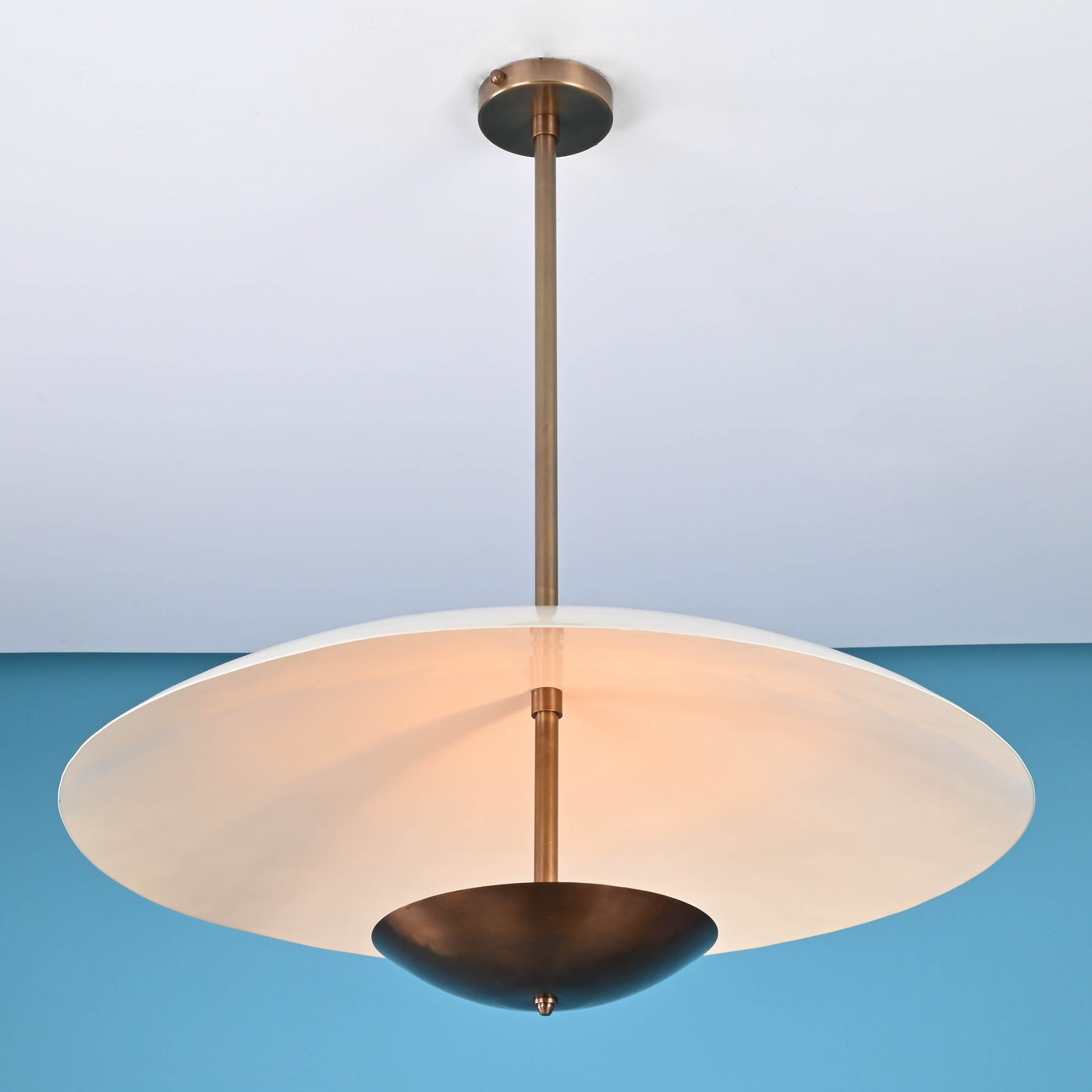 Modern brass pendant light with wide dome shade and suspended design, handmade by Brass Leaf Studio, ideal for living rooms and dining spaces.