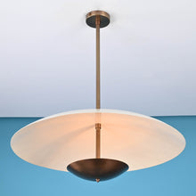 Modern brass pendant light with wide dome shade and suspended design, handmade by Brass Leaf Studio, ideal for living rooms and dining spaces.
