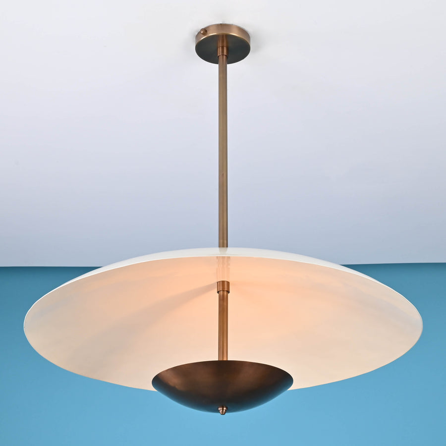 Modern brass pendant light with wide dome shade and suspended design, handmade by Brass Leaf Studio, ideal for living rooms and dining spaces.