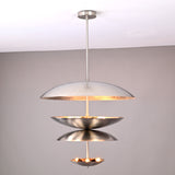 Modern multi-tier brass disc chandelier with sculptural floating bowls and soft uplighting by Brass Leaf Studio.