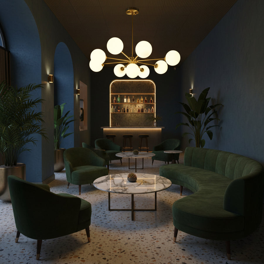 Brass Leaf Studio Naples chandelier featuring nine glass globes, brushed brass finish, and starburst design