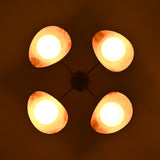 Night bottom view of opal globe brass ceiling light casting soft indirect lighting