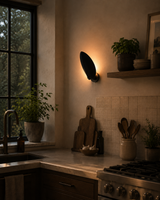 Brass Leaf Studio petal wall sconce made from solid brass with artistic curved shield design