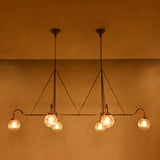 Brass Leaf Studio ribbed glass globe chandelier with six lights, brass frame, and luxury statement ceiling design