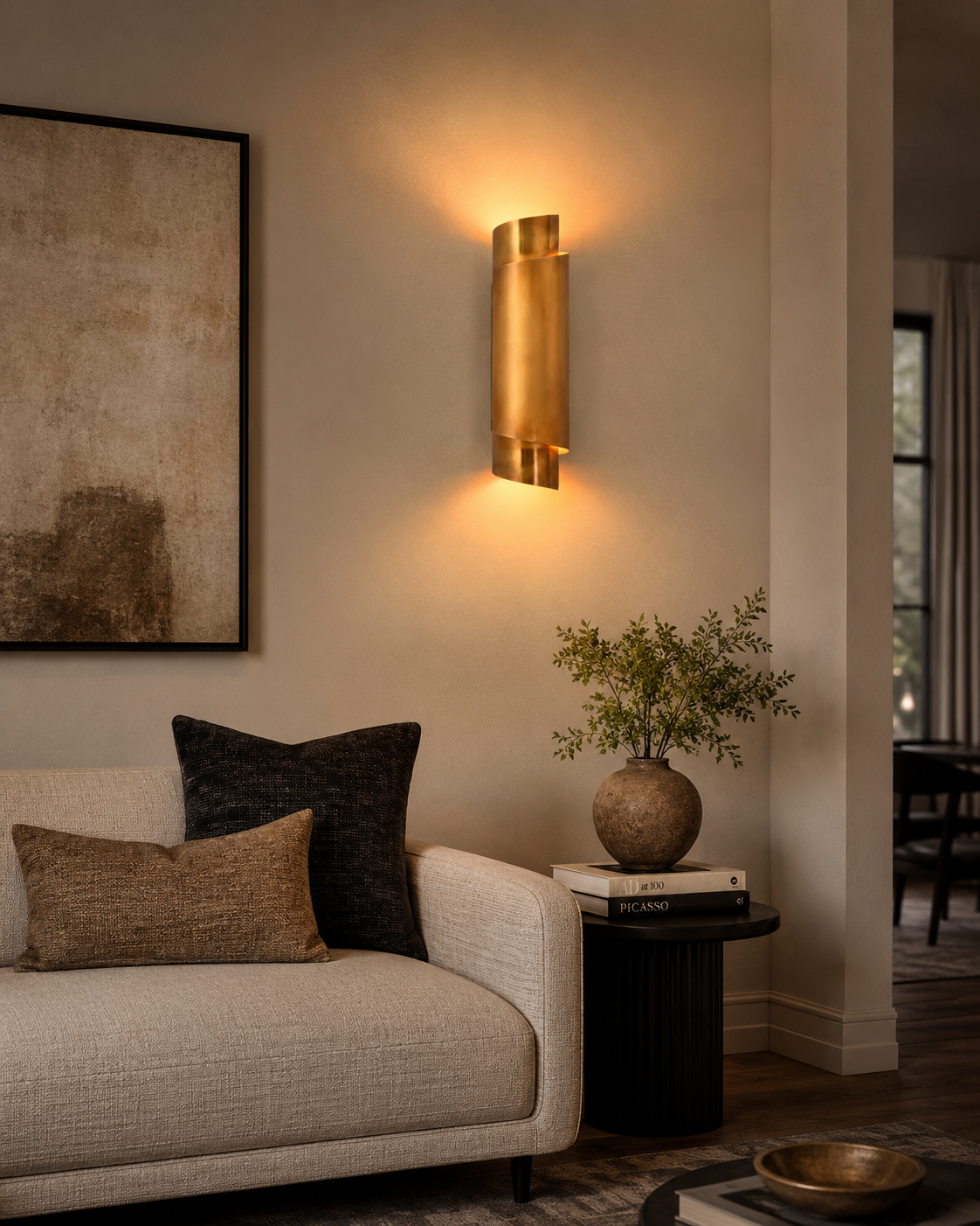 Brass Leaf Studio ribbon wall sconce with layered curved brass design and ambient wall wash