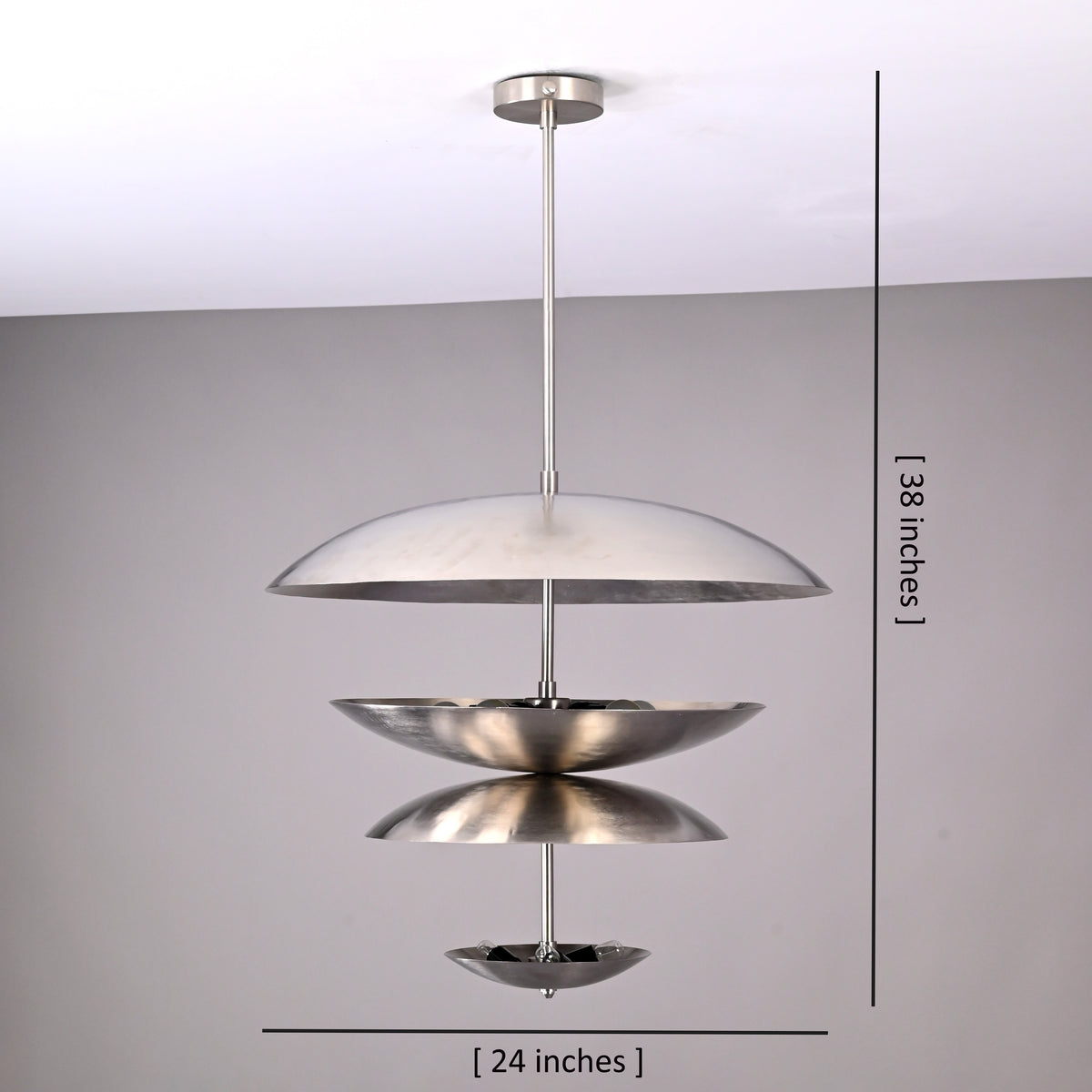 Tiered disc chandelier measuring 24 inches wide and 38 inches tall, featuring layered metallic bowls and a modern hanging design.