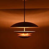 Brass Leaf Studio tiered pendant light with layered circular shades, white diffuser, and premium ceiling light design