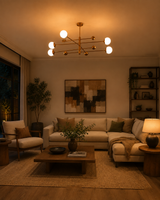 Brass linear chandelier creating warm lighting in a luxury bedroom interior with soft globe shades