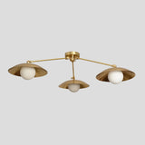 Front view of handmade brass flushmount ceiling light featuring three bowl-shaped shades with round bulbs for warm ambient illumination.
