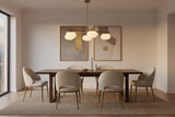 Brass linear chandelier with five oval opal glass balls arranged on a sculptural ceiling frame